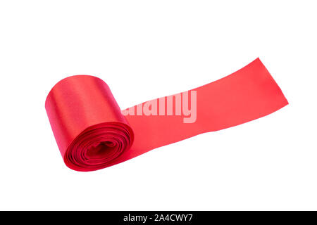 a red fabric tape rolled into an elongated strip isolated on white Stock Photo