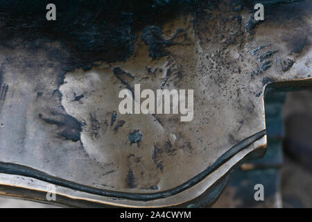 Grunge metal background or texture with scratches and cracks. Close up of texture on bronze metal. Stock Photo