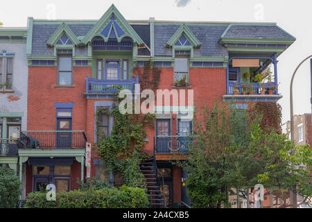 Montreal, typical victorian house with exterior staircase in the Plateau Mont-Royal district in autumn Stock Photo