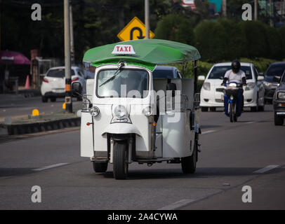 Chiangmai, Thailand -  October 10 2019: Tuk tuk taxi chiangmai Service in city and around. Photo at  Road to chiangmai city. Stock Photo