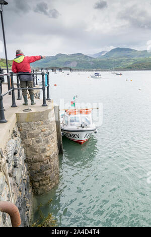 Emily's Ferry and boat rides crossing Barmouth Harbour in Gwynedd on the North Wales coast Cardigan Bay Stock Photo