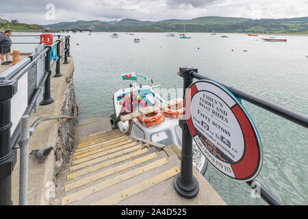 Emily's Ferry and boat rides crossing Barmouth Harbour in Gwynedd on the North Wales coast Cardigan Bay Stock Photo