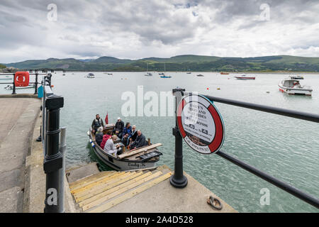 Emily's Ferry and boat rides crossing Barmouth Harbour in Gwynedd on the North Wales coast Cardigan Bay Stock Photo