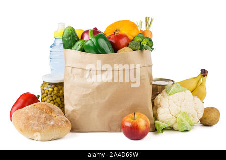 Paper bag full of various groceries - fresh fruits and vegetables, bread. Food delivery concept. Stock Photo