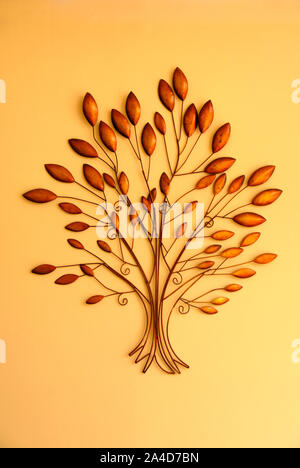 Attractive scuplture in the form of a tree on display as a wall hanging. Stock Photo