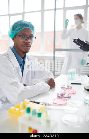 Portrait of young African-American man looking at camera while working in medical laboratory, copy space Stock Photo