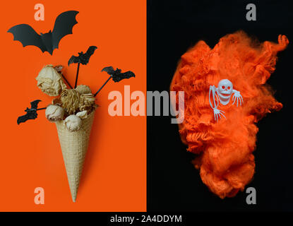 Halloween background with ice cream cone with dried flowers ,bats and orange torch in the shape of a heart, skull on black-orange background.Halloween Stock Photo