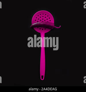 Bright yellow plastic kitchen utensils - cooking concept. Flat lay image of ladle, whisk, skimmer spoon and spatulas with copy space. Upside position Stock Photo