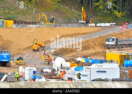 Heavy equipment & workmen working on foundation work at construction industry building site at Milburngate mixed use property development Durham UK Stock Photo