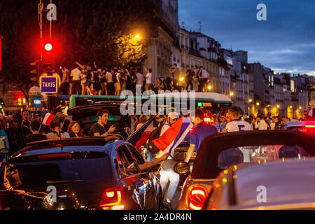 FANS ON A RATP PUBLIC TRANSPORT BUS, SCENE OF JUBILATION FOLLOWING THE FRENCH SOCCER TEAM'S VICTORY IN THE SEMI-FINALS OF THE WORLD CUP, FRANCE - BELGIUM, PLACE SAINT MICHEL, PARIS, FRANCE, EUROPE Stock Photo