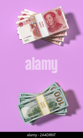 American 100 Dollar and chinese 100 Yuan banknotes on pink background - 3D rendering Stock Photo