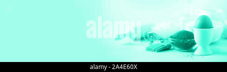 Knitted texture. Pattern fabric made of wool in mint color. Background, copy space. Biscay Green color of the year 2020 Stock Photo