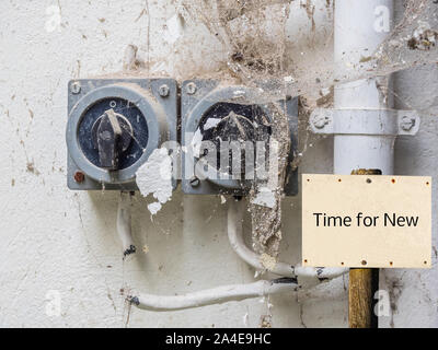 Old switch 'Time for New' sign Stock Photo