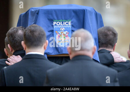 The police insignia on the coffin at the funeral of PC Andrew Harper, the Thames Valley Police officer who died from multiple injuries after being dragged under a van while responding to reports of a burglary, as the cortege arrives in the quadrangle at Christ Church Cathedral in St Aldate's, Oxford. Stock Photo