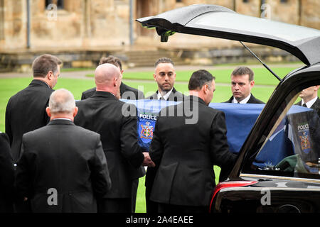 Pallbearers carry the coffin of PC Andrew Harper, the Thames Valley Police officer who died from multiple injuries after being dragged under a van while responding to reports of a burglary, as the cortege arrives in the quadrangle at Christ Church Cathedral in St Aldate's, Oxford. Stock Photo