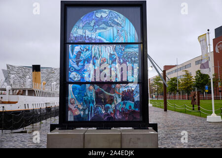 Games of thrones tribute stain glass window develop by city of Belfast on a grey day with Titanic museum in background. White Walker themed window Stock Photo
