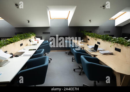 Empty co-working workplace modern open space no people Stock Photo