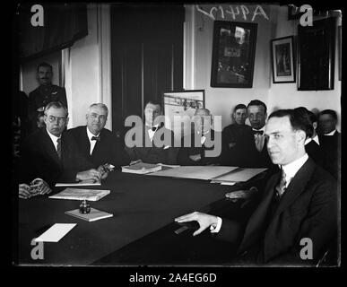 Theodore Roosevelt, Jr., former Secretary of the Navy and General William Mitchell, Assistant Chief of the Army Air Service appeared before the House Military Affairs committee, today, Feb. 17th. Roosevelt told the committee that aircraft was a supplementsupplementary arm of the National Defense and should be kept that way, while Gen. Mitchell continued his fight for the unification of the air services. In the group, left to right: Rep. Wm. C. Wright, George Stock Photo