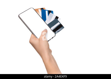 Woman's hand holding smartphone with blank screen and credit cards Stock Photo
