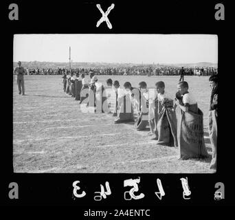 Third annual sports meeting of the government schools of the Jerusalem sub-district, on Government Arab College ground (near Government House). The sack race Stock Photo