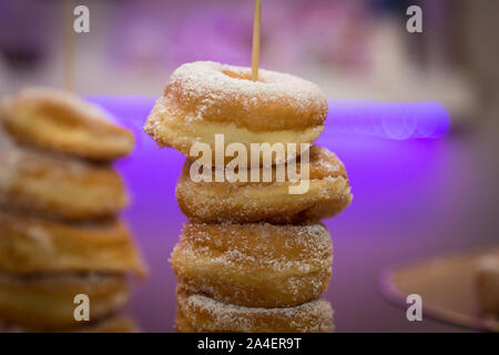 Closeup of a pile of sugared donuts, typical fried donuts. Stock Photo