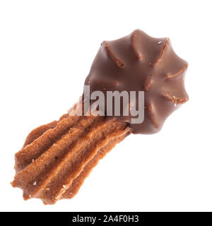 Christmas pastry:  Single dark cookie with chocolate on one end from above, isolated on white background Stock Photo