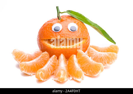 Laughing Mandarin with slices in front of it Stock Photo