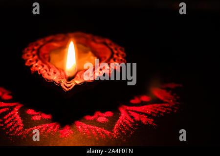 Macro shot of a flame from a decorative Terracotta lamp used in Diwali Stock Photo