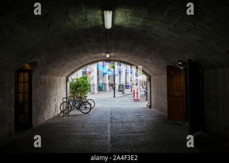 Gibraltar, UK - July 27th 2019: Gate of Landport tunnel.  Grand Casemates Square at bottom, Gibraltar, UK Stock Photo