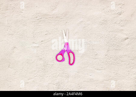 Pink scissors on the table Stock Photo