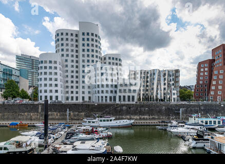 Media Harbour - MedienHafen - on the banks of the Rhein in Dusseldorf. Featuring Frank Gehry's striking buildings - Neuer Zollhof - completed in 1998. Stock Photo