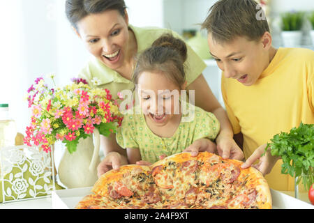 Close up portrait of big happy family eating pizza together Stock Photo