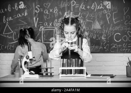 Confident medical experts. childrens day. Little children at school lesson. students doing biology experiments with microscope. Chemistry. Back to school. Little kids learning chemistry in school lab. Stock Photo