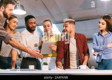 Colleagues brainstorming together, discussing ideas in office Stock Photo