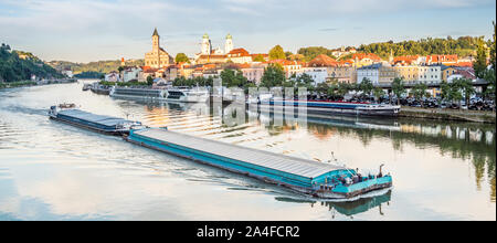 Container ship drives through Passau harbor Stock Photo