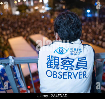 Hong Kong. 14th October 2019. Tens of thousands of pro-democracy demonstrators  attended a peaceful rally in Chater Garden in Central on Monday night, calling on the US to pass the Hong Kong Human Rights and Democracy Act of 2019 that would sanction officials who undermine people's rights in the Hong Kong SAR ( Special Administrative region). Many Stars and Stripes flags and pro-USA slogans were displayed by the demonstrators. Iain Masterton/Alamy Live News. Stock Photo
