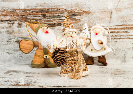 Christmas dolls made with fabric on a wooden table Stock Photo