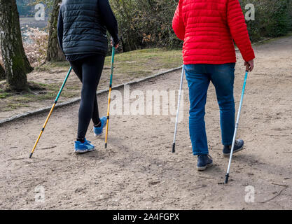 Two women doing nordic walking in spring Stock Photo