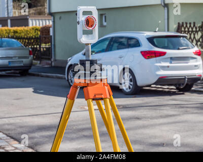 Surveying technology on a Street Stock Photo