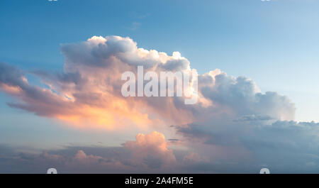 Blue sunset sky with many nice white clouds Stock Photo