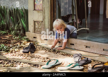 Portrait of cute baby boy crawling at backyard Stock Photo