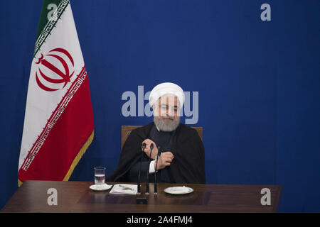 Tehran, Iran. 14th Oct, 2019. Iranian President HASSAN ROUHANI leaves a press conference in Tehran, Iran. Credit: Rouzbeh Fouladi/ZUMA Wire/Alamy Live News Stock Photo