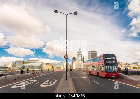 London bridge with the city of london and a double decker Stock Photo