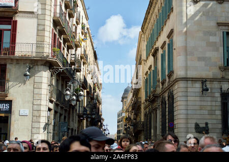 People watching human towers at Placa de Sant Jaume in Barcelona, Spain Stock Photo