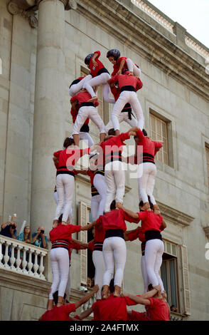 Castellers building castells/human towers at the 2019 La Merce Festival at Placa de Sant Jaume in Barcelona, Spain Stock Photo
