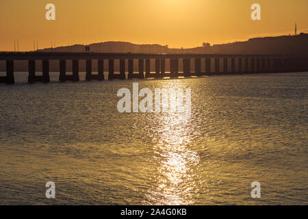 The Tay Road bridge silhouetted at sunrise. Stock Photo