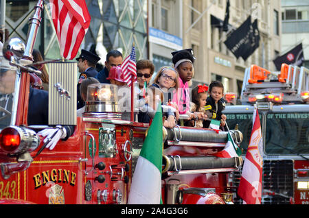 New York, United States. 14th Oct, 2019. NEW YORK, NY - OCTOBER 14, 2019: Participants marching up Fifth Avenue in New York City during the annual Columbus Day parade on October 14, 2019. (Photo by Ryan Rahman/Pacific Press) Credit: Pacific Press Agency/Alamy Live News Stock Photo