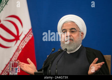 Tehran, Iran. 14th Oct, 2019. Iranian President Hassan Rouhani speaks at a press conference in Tehran, Iran, on Oct. 14, 2019. Iranian President Hassan Rouhani said on Monday that his country does not endorse Turkey's approach to the current issues in northern Syria. Credit: Ahmad Halabisaz/Xinhua/Alamy Live News Stock Photo