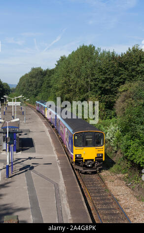 Arriva Northern rail class 150 sprinter train  + class 142 pacer train  passing the island platform at Ince railway station near Wigan, Lancashire, UK Stock Photo