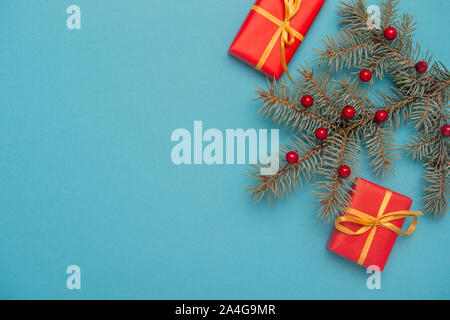 Christmas gift boxes with decoration on blue background. Stock Photo